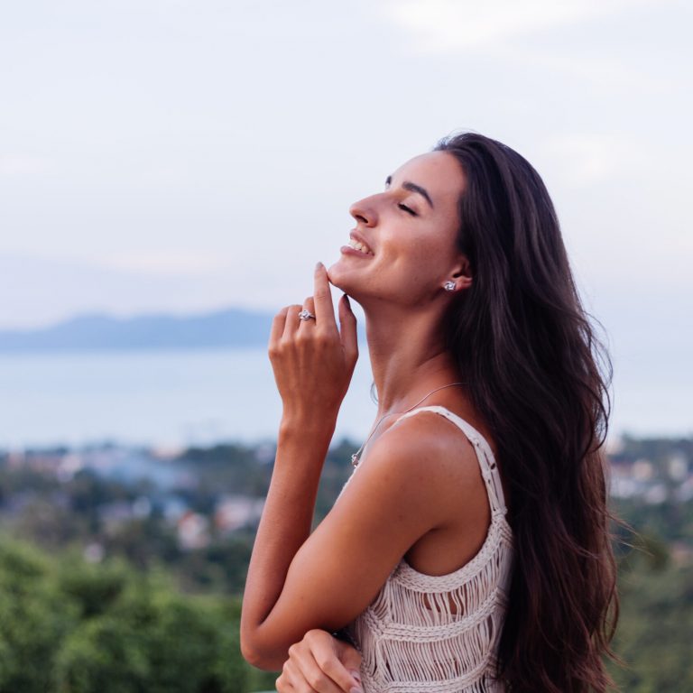 portrait-happy-caucasian-calm-romantic-woman-casual-look-with-long-hair-wearing-earings-necklace-background-amazing-beautiful-view-green-mountains